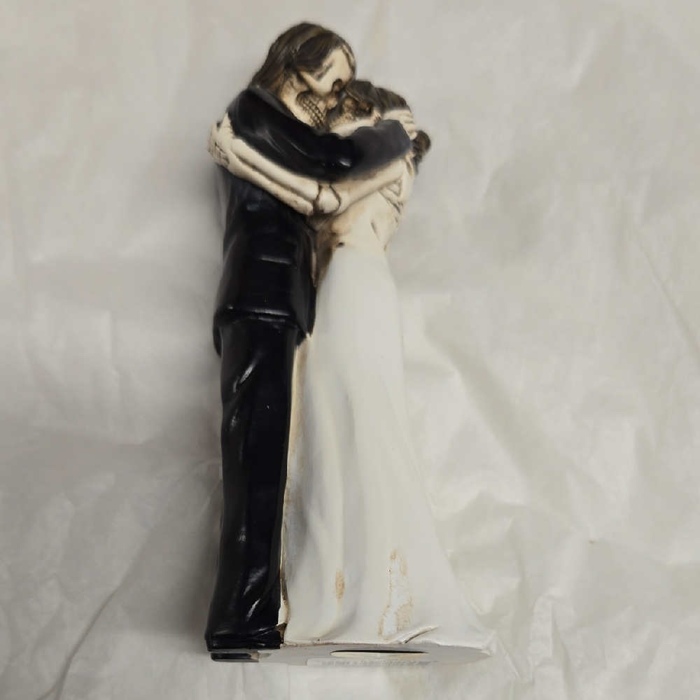 Elegant Black and White Embracing Couple Figurine